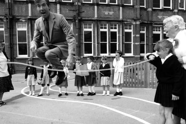 Former MP David Martin joins in playtime with children from Milton Park School. The News PP3773
