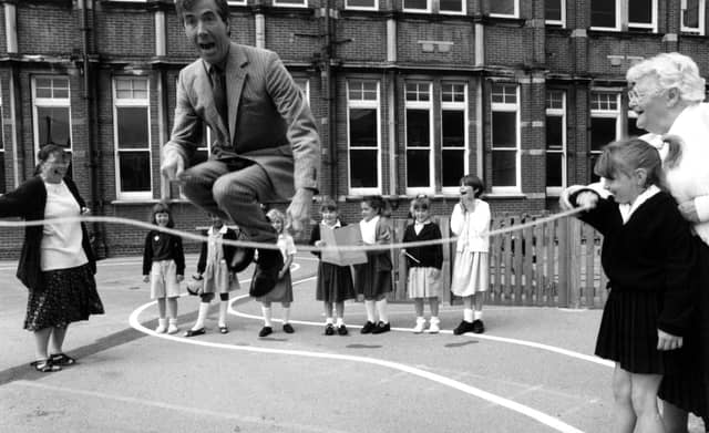 Former MP David Martin joins in playtime with children from Milton Park School. The News PP3773