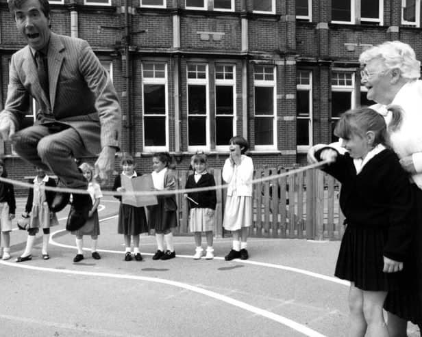 Former MP David Martin joins in playtime with children from Milton Park School. The News PP3773