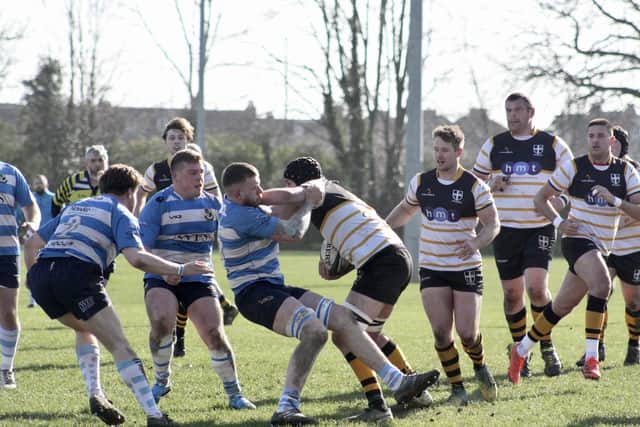Portsmouth (yellow/black/white) in action during their home loss to Warlingham at Rugby Camp. Picture: Hannah Smith.