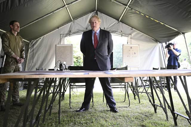 Britain's Prime Minister Boris Johnson meets soldiers of the new Ranger Regiment, during a visit to mark Armed Forces Week, at the Aldershot Garrison in Aldershot, Hampshire earlier today. Daniel Leal-Olivas/Pool via PA