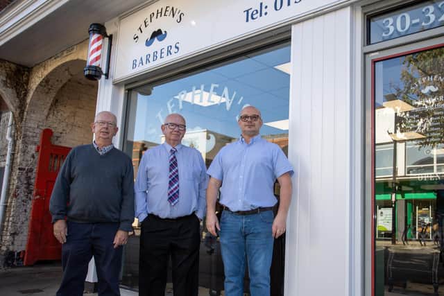 Steve Haines of Stephen's Barbers celebrating 100 years of business with his brother Roger (right) and son Sean (left). Photo by Alex Shute