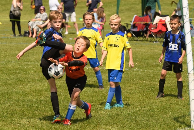 Action from the Clanfield youth football tournament at Horndean Technology College. Picture: Keith Woodland (270521-727)