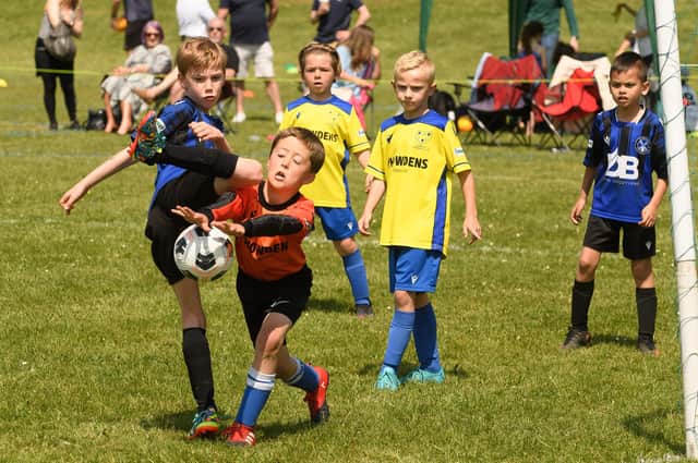 Action from the Clanfield youth football tournament at Horndean Technology College. Picture: Keith Woodland (270521-727)
