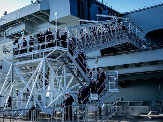 Pictured: Sailors leaving HMS Prince of Wales.