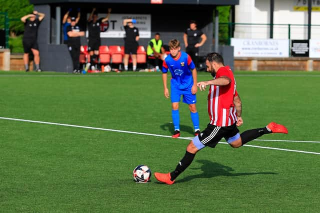 Brett Pitman about to score one of his two second-half penalties against Fareham. Picture by Ken Walker