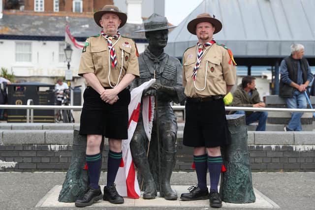 Rover Scouts Chris Arthur (left) and Matthew Trott pose for a photograph in front of a statue of Robert Baden-Powell on Poole Quay in Dorset ahead of its expected removal to "safe storage" following concerns about his actions while in the military and "Nazi sympathies". The action follows a raft of Black Lives Matter protests across the UK, sparked by the death of George Floyd, who was killed on May 25 while in police custody in the US city of Minneapolis. PA Photo. Picture date: Thursday June 11, 2020. See PA story POLICE Floyd. Photo credit should read: Andrew Matthews/PA Wire 