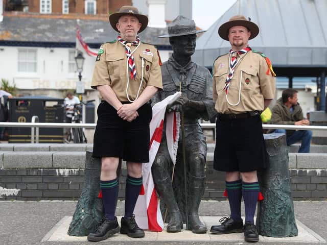Rover Scouts Chris Arthur (left) and Matthew Trott pose for a photograph in front of a statue of Robert Baden-Powell on Poole Quay in Dorset ahead of its expected removal to "safe storage" following concerns about his actions while in the military and "Nazi sympathies". The action follows a raft of Black Lives Matter protests across the UK, sparked by the death of George Floyd, who was killed on May 25 while in police custody in the US city of Minneapolis. PA Photo. Picture date: Thursday June 11, 2020. See PA story POLICE Floyd. Photo credit should read: Andrew Matthews/PA Wire 