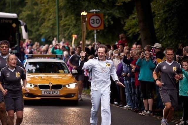 Roger Sherliker when he carried the Olympic torch in 2012