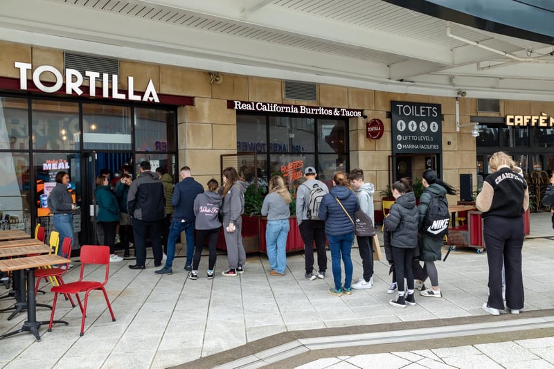 Queues outside Tortilla, Gunwharf Quays for the free burritos.Picture: Mike Cooter