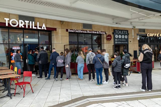 Queues outside Tortilla, Gunwharf Quays for the free burritos.Picture: Mike Cooter