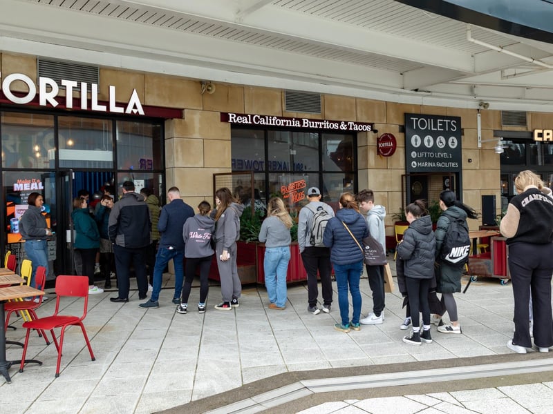Queues outside Tortilla, Gunwharf Quays for the free burritos.Picture: Mike Cooter