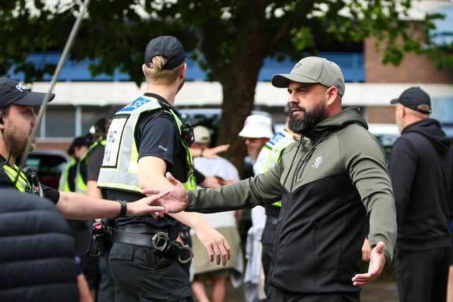 Protestors at Guildhall Square, Portsmouth. Some demonstrators had verbal exchanges between police and counter-protestors. Picture: Chris  Moorhouse (030824-50)
