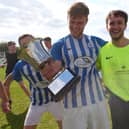 Coach & Horses Albion keeper Adam Puckett, right, after his three shoot-out saves helped his side win the Challenge Cup. Picture: Chris Moorhouse