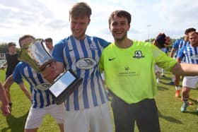 Coach & Horses Albion keeper Adam Puckett, right, after his three shoot-out saves helped his side win the Challenge Cup. Picture: Chris Moorhouse