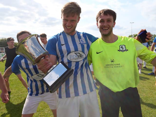 Coach & Horses Albion keeper Adam Puckett, right, after his three shoot-out saves helped his side win the Challenge Cup. Picture: Chris Moorhouse