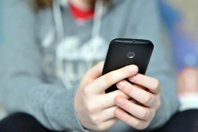 File photo of a child using a phone
