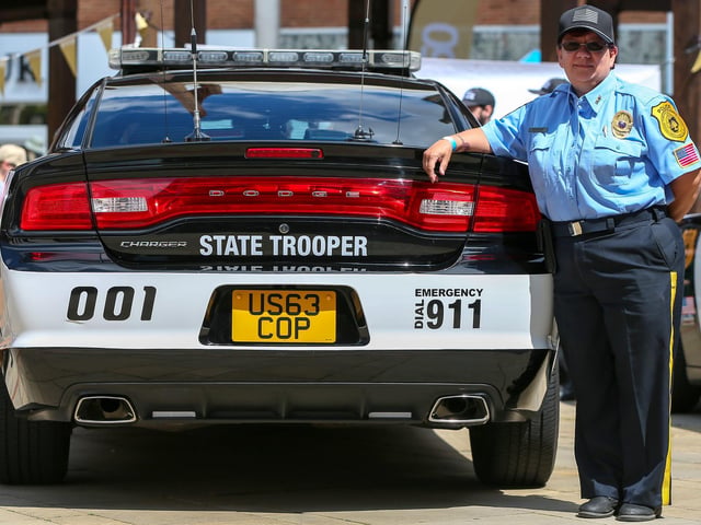 Sharon Evans with an American police car at Fareham 999 Day, West Street, Fareham.Picture: Chris Moorhouse (220624-18)