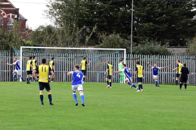 Owen Milne (out of picture) has just given Denmead a second minute lead from a free-kick.

Photograph by Sam Stephenson