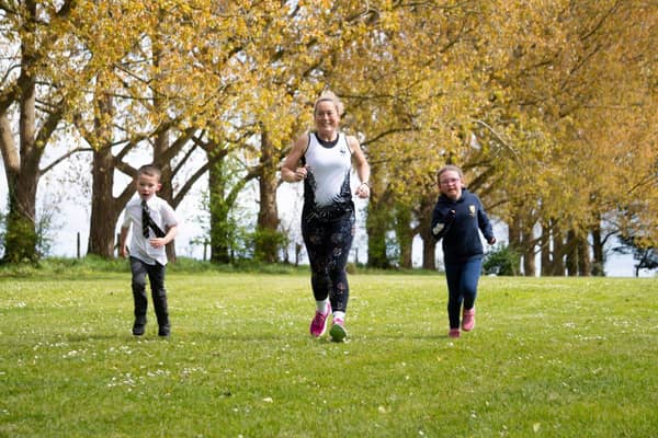 Mrs Pettit running with two Boundary Oak pupils during the Virtual TCS Mini Marathon