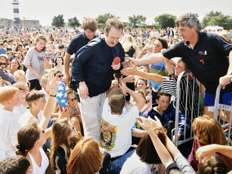 The Radio 1 Roadshow in Southsea, in 1994. Steve Wright picks his way through the crowds on Castle Field.