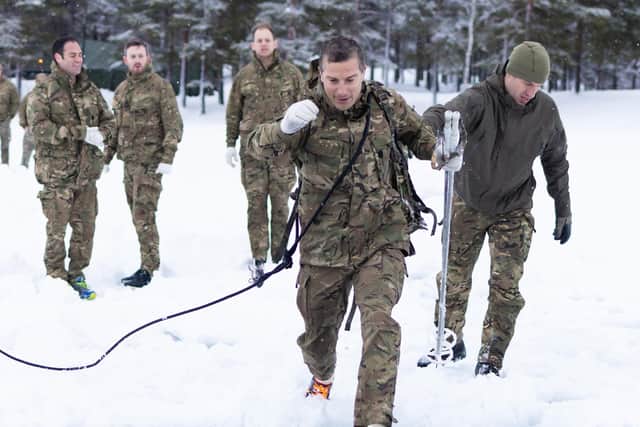 Honorary Colonel Bear Grylls OBE visits around Skjold training area meeting ranks partaking in extreme cold weather training during Ex CETUS 22.
