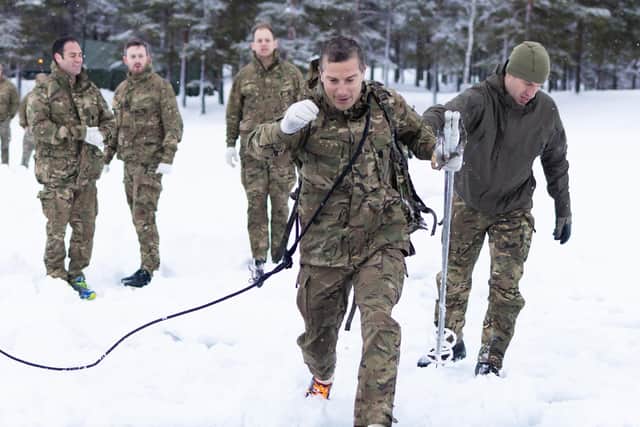 Honorary Colonel Bear Grylls OBE visits around Skjold training area meeting ranks partaking in extreme cold weather training during Ex CETUS 22.