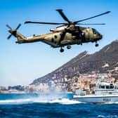 Pictured is a Commando helicopter force Merlin Mk3 helicopter and HMS Scimitar, a Scimitar-class fast patrol boat, conducting reassurance and demonstration of UK sovereignty in British Gibraltar Territorial Waters in 2016. Photo: Royal Navy.
