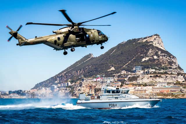 Pictured is a Commando helicopter force Merlin Mk3 helicopter and HMS Scimitar, a Scimitar-class fast patrol boat, conducting reassurance and demonstration of UK sovereignty in British Gibraltar Territorial Waters in 2016. Photo: Royal Navy.