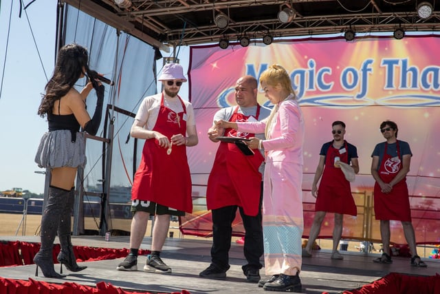 Volunteers take part in a food competition on the stage at the The Southsea Thai Food and Craft Festival. Photos by Alex Shute