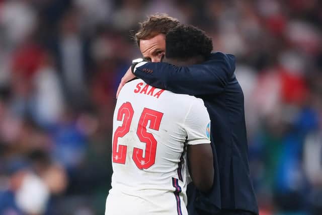 Bukayo Saka of England is consoled by Gareth Southgate following England's defeat by Italy. Photo by Laurence Griffiths/Getty Images