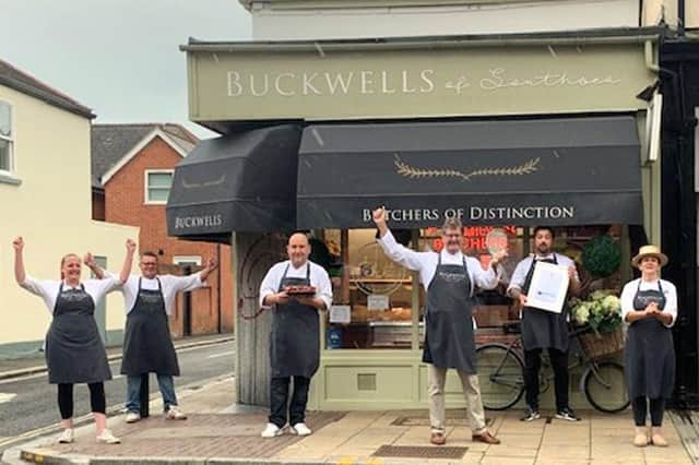 Owner John Buckwell is pictured centre with the best of the best Diamond trophy the shop clinched with its Mighty Steak Skewers, one of multiple awards gained in the Q Guild 2020 Smithfield Star Awards