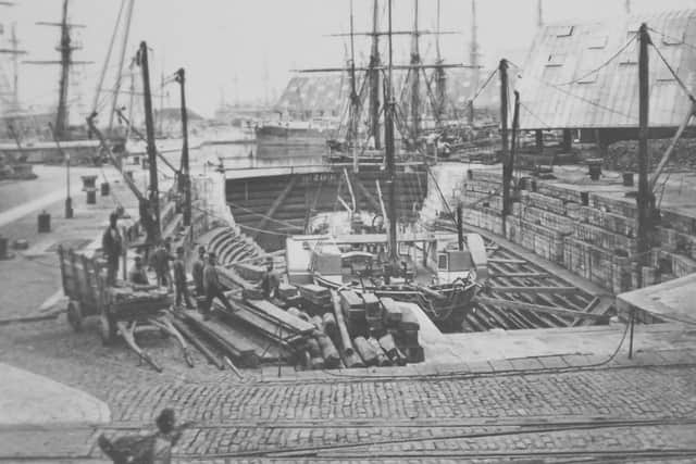 A very early photograph of a dry dock in Portsmouth dockyard possibly taken in 1865. Picture: Barry Cox postcard collection
