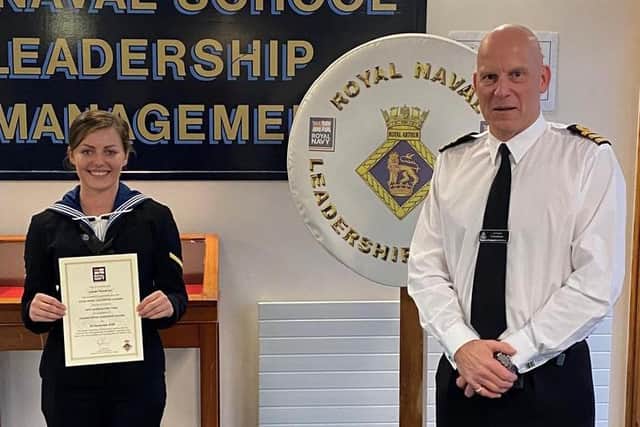 Able Seaman Henrietta Goodrum had just graduated from her Leading Rates’ leadership course at HMS Collingwood in Fareham, when she was surprised by her father, 40-year Commander Simon Goodrum. Photo: Royal Navy