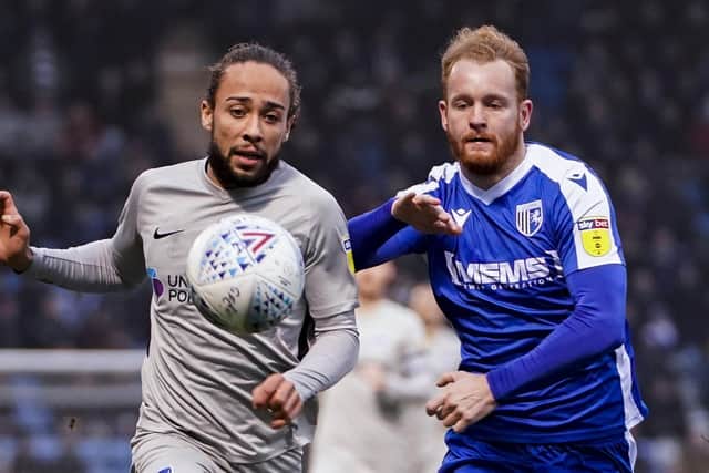 Connor Ogilvie, right, in action for Gillingham against Pompey. Picture: Jason Brown