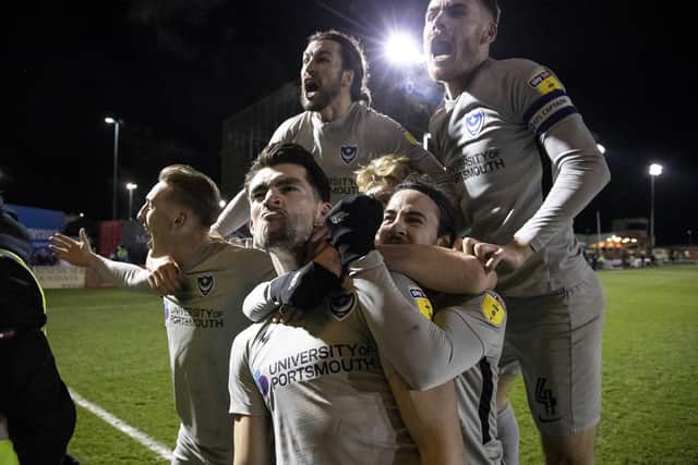 Pompey celebrate John Marquis' penalty at Lincoln. Picture: Daniel Chesterton/phcimages.com