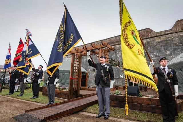 The lowering of the colours at the ceremony. Picture: Paul Collins.