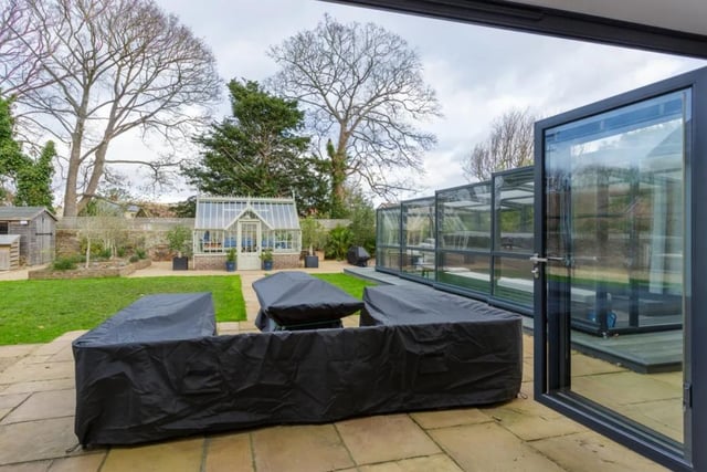 Equipped with a gym and a swim spa which is covered up in the back garden with a greenhouse style building - this home has so much potential.