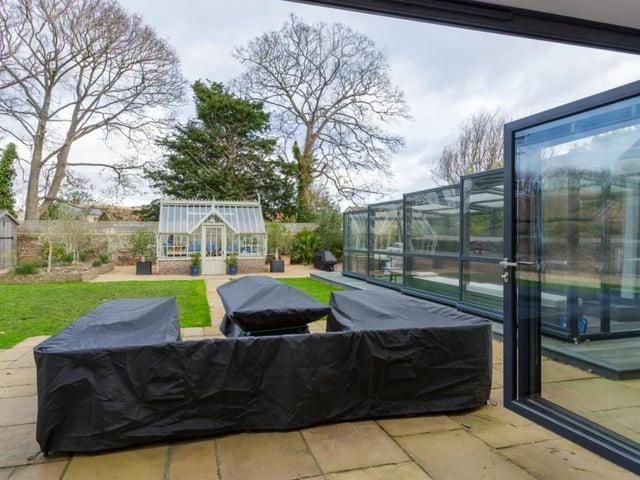 Equipped with a gym and a swim spa which is covered up in the back garden with a greenhouse style building - this home has so much potential.