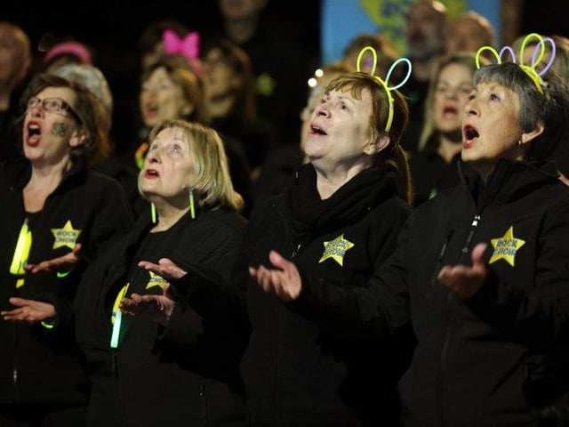 Rock Choir singing at Glow Walk Southsea on March 18, 2022