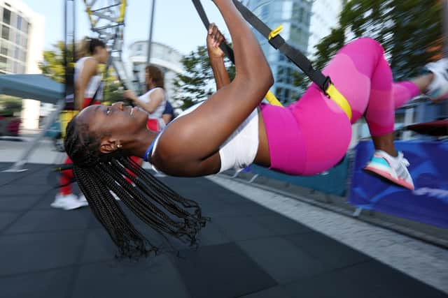 Frida Amponsah on the swings. Sweat Fitness Festival, Gunwharf Quays. Picture: Chris Moorhouse  (jpns 180921-25)