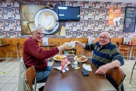 Friends veteran Clive Sutton and Ian Noble get together in Cafe Nut, Portsmouth. Picture: Habibur Rahman