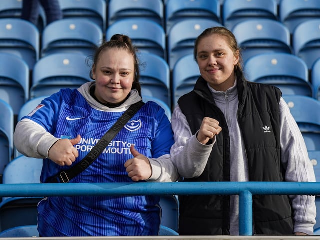 Made it! These Pompey fans look happy after finally arriving at Brunton Park after an early start.