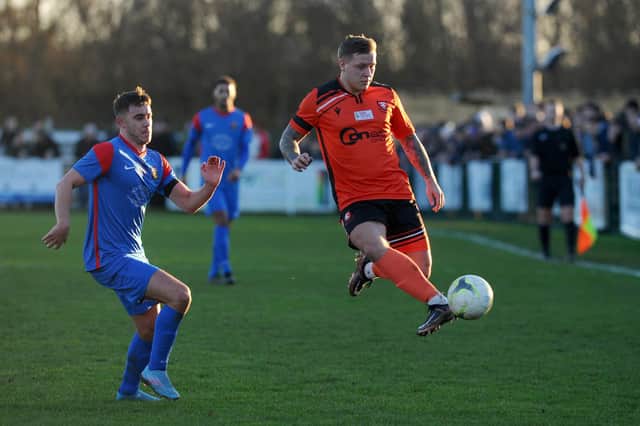Portchester's Jake Raine, right, during the January 2023 'El Creekio' derby which attracted an all-time record Wessex League attendance to the On-Site Group Stadium. Picture: Sarah Standing