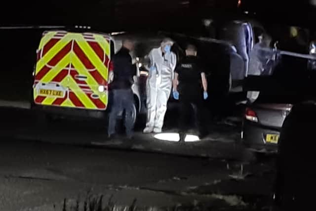 Police in forensic clothing attended the scene of the incident.