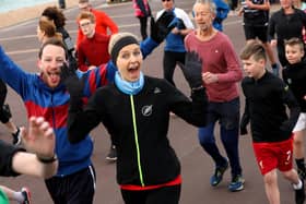 Runners smile and wave for the camera in the Southsea parkrun Picture: Sam Stephenson
