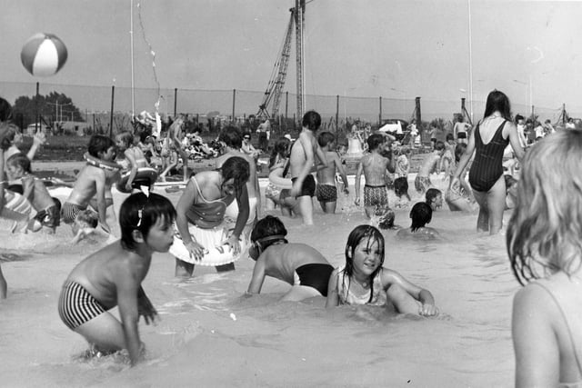 Looks like fun! Children enjoying the splash pool in August 1973