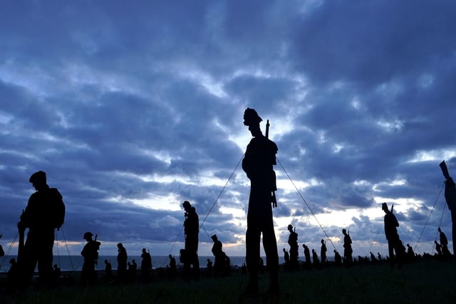 A view of the Standing with Giants silhouettes which create the For Your Tomorrow installation at the British Normandy Memorial, in Ver-Sur-Mer, France, as part of the  80th anniversary of D-Day.