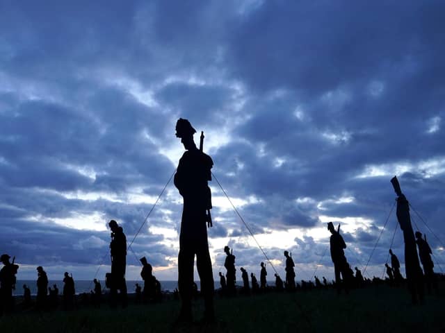 A view of the Standing with Giants silhouettes which create the For Your Tomorrow installation at the British Normandy Memorial, in Ver-Sur-Mer, France, as part of the  80th anniversary of D-Day.