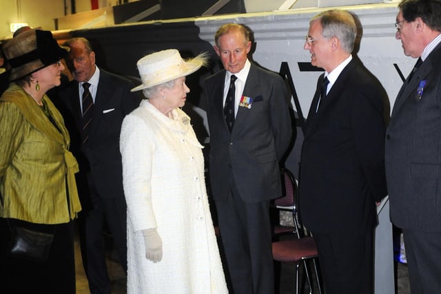 The Queen visits Portsmouth, pictured at the D-Day Museum chatting to Stephen Brooks who was a curator at the museum.